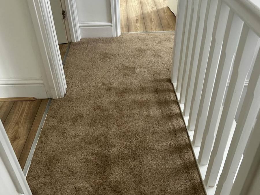 Fitted carpet on a stair landing