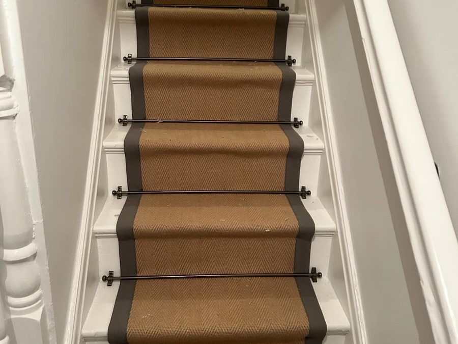 Striped carpet runner fitted on a staircase